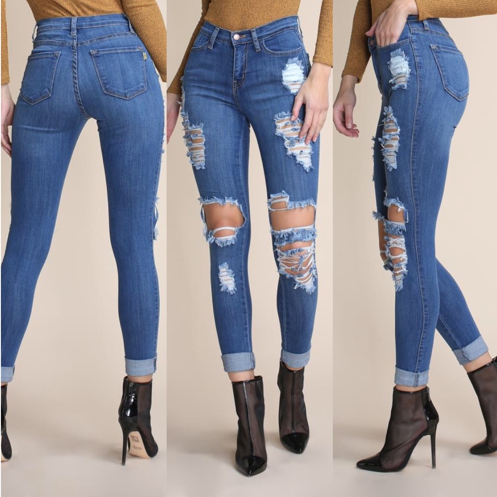 Mid-rise distressed skinny jeans